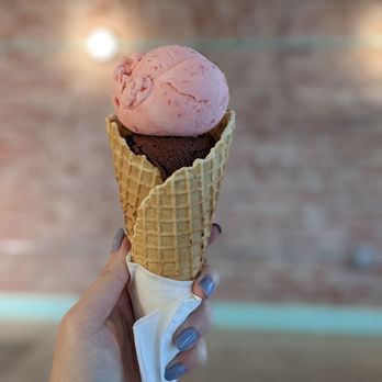 Moo Moo Mia - Split single scoops of strawberry sorbet (top) and chocolate oat milk ice cream (bottom), on a waffle cone. - Ice Cream & Frozen Yogurt Near Me - Monrovia, California
