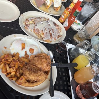 Brunch Snob - (Front to back) Mother Clucker, Big Ass Cinnamon Roll French Toast & then the Brisket breakfast tacos... With a Mimosa Flight on the right - Breakfast & Brunch Near Me - Phoenix, Arizona Brunch Snob - (Front to back) Mother Clucker, Big Ass Cinnamon Roll French Toast & then the Brisket breakfast tacos... With a Mimosa Flight on the right - Breakfast & Brunch Near Me - Phoenix, Arizona