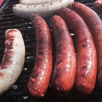 Sausage Masters - a bunch of sausages cooking on a grill - Street Vendors Near Me - Anaheim, California Sausage Masters - a bunch of sausages cooking on a grill - Street Vendors Near Me - Anaheim, California
