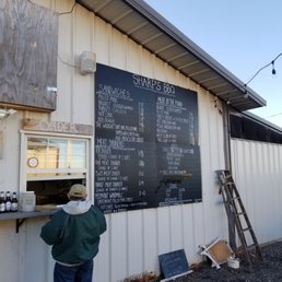 a man standing in front of a chalkboard a man standing in front of a chalkboard