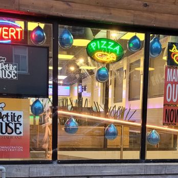 Lapetite Pause - a storefront window with neon signs - Pizza Near Me - Montreal, Quebec Lapetite Pause - a storefront window with neon signs - Pizza Near Me - Montreal, Quebec