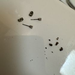 FINAO Ink Tattoo Company - Corroded earrings and black oxidized gunk.