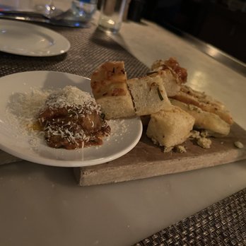 Trattoria Il Mulino - Complimentary focaccia bread and a tapenade. - Italian Near Me - Nashville, Tennessee