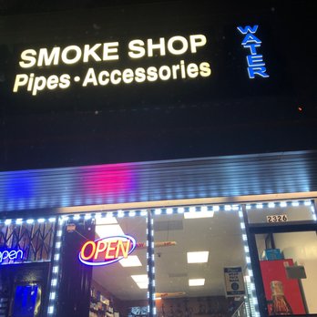 Double A Smoke Shop - a neon sign above the entrance - Tobacco Shops Near Me - Los Angeles, California Double A Smoke Shop - a neon sign above the entrance - Tobacco Shops Near Me - Los Angeles, California