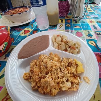 Ay Caramba - Scramble eggs with chorizo plate with refried beans and potatoes - Mexican Near Me - Houston, Texas