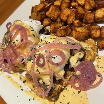 Frontier Perk Cafe - Short Rib Breakfast Stack. Perfect poached eggs topping short rib and hash browns. Served with breakfast potato. - Cafes Near Me - St. Charles, Missouri