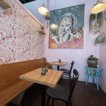 Chez Alex - Back-half of the cafe, showcasing some unique art, plants, and seating - Bakeries Near Me - Brooklyn, New York Chez Alex - Back-half of the cafe, showcasing some unique art, plants, and seating - Bakeries Near Me - Brooklyn, New York