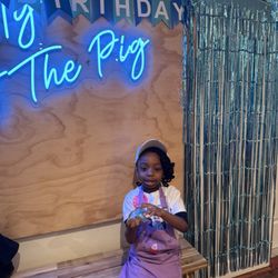 The Giggling Pig - Birthday girl taking a photo break from making slime