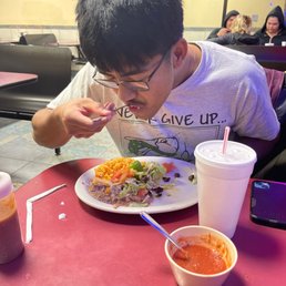 Moses devouring his taco platter Moses devouring his taco platter