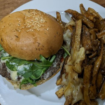 Tavern 1883 - Bison burger with side of poutine (instead of fries) - Pubs Near Me - Canmore, Alberta Tavern 1883 - Bison burger with side of poutine (instead of fries) - Pubs Near Me - Canmore, Alberta