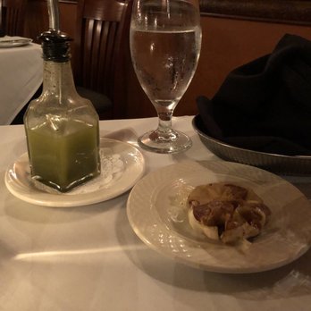 Collage Restaurant - Bread service including roasted garlic and basil infused oil. - New American Near Me - St Augustine, Florida