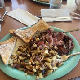 Home fries,eggs and bacon and toast