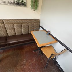 The only seating that isn't hard wood is only for large parties & not for those with disabilities according to the staff