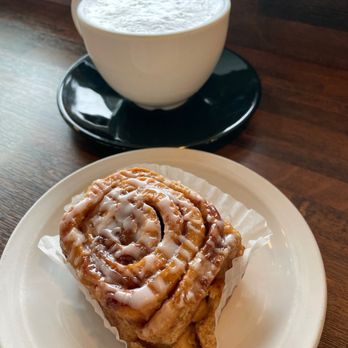 Hoffman's Fine Cakes & Pastries - Chai latte (top) & cinnamon roll (bottom) - Bakeries Near Me - Redmond, Washington Hoffman's Fine Cakes & Pastries - Chai latte (top) & cinnamon roll (bottom) - Bakeries Near Me - Redmond, Washington