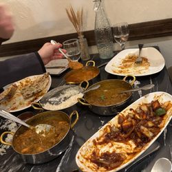 Haveli Indian Cuisine - Teenagers attaching tasty indian food