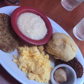 Ruby Slipper Decatur - Stone Ground Grits, eggs, Buttermilk Biscuit, turkey Chicken Sausage Patties, fried green tomatoes, Cajun butter - Breakfast & Brunch Near Me - New Orleans, Louisiana Ruby Slipper Decatur - Stone Ground Grits, eggs, Buttermilk Biscuit, turkey Chicken Sausage Patties, fried green tomatoes, Cajun butter - Breakfast & Brunch Near Me - New Orleans, Louisiana