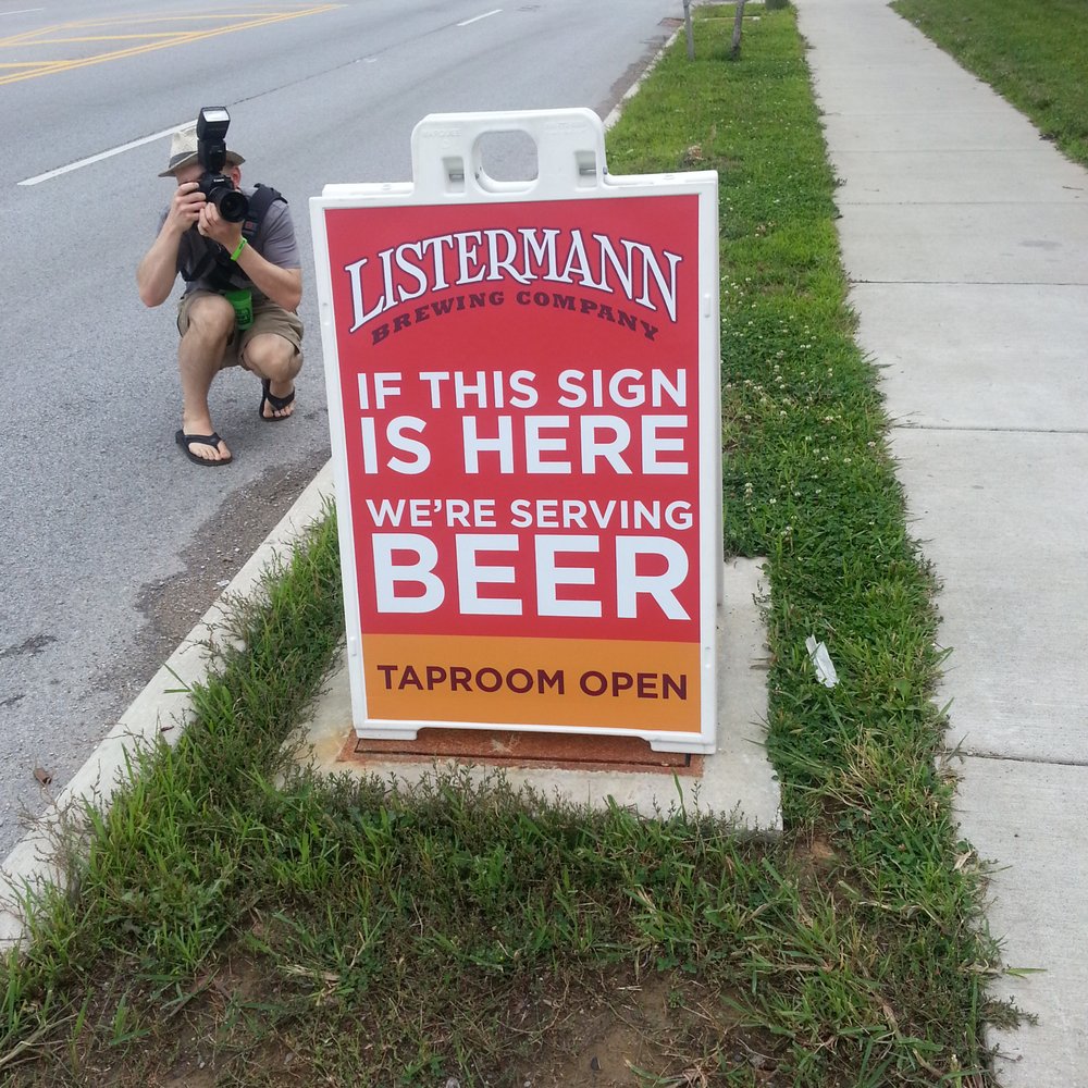 Yelp's Craft Connection Brewery Tour! - Clever sign with John working away at the event - Beer Tours Near Me - Cincinnati, Ohio Yelp's Craft Connection Brewery Tour! - Clever sign with John working away at the event - Beer Tours Near Me - Cincinnati, Ohio