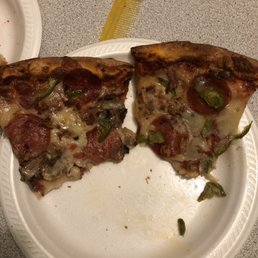 two slices of pizza on a paper plate