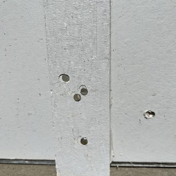 TRS Build - Unpainted nails. These are on most of the pieces of siding. The siding is textured unlike the other siding on our home which is smooth. - General Contractors Near Me - Cedar Park, Texas