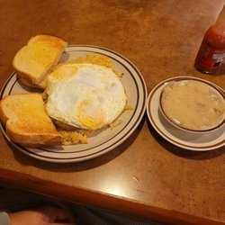 T's Family Restaurant - 2 over easy eggs topping the hashbrown casserole n sausage....and a side of sausage gravy