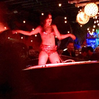 Clifton's Republic - Dancer dancing on top of DJ Boat display - Bars Near Me - Los Angeles, California