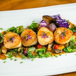 Jumbo shrimp and sea scallops with three flavored chili sauce, fried brussel sprouts and eggplant