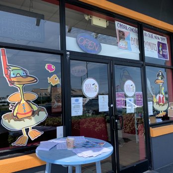 Duck Donuts - a blue table outside of a restaurant - Donuts Near Me - Kill Devil Hills, North Carolina
