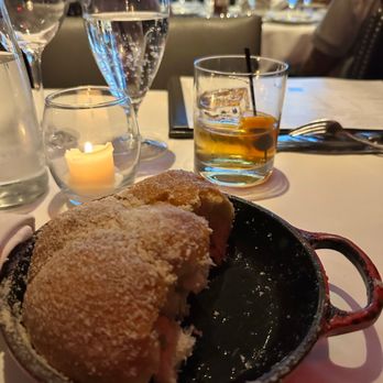 Steak 44 - Bread at the table with an old fashion in the background - Steakhouses Near Me - Phoenix, Arizona Steak 44 - Bread at the table with an old fashion in the background - Steakhouses Near Me - Phoenix, Arizona