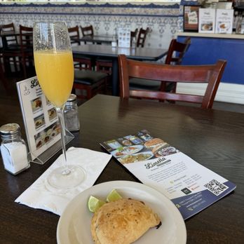Limeña Peruvian Eatery - Ham & cheese empanada and mimosa - Peruvian Near Me - Thousand Oaks, California Limeña Peruvian Eatery - Ham & cheese empanada and mimosa - Peruvian Near Me - Thousand Oaks, California