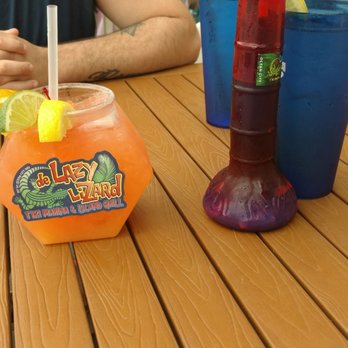 De Lazy Lizard - Left is an adult fish bowl, and on the right is the kids slushy in a suvinor cup. - American Near Me - Ocean City, Maryland De Lazy Lizard - Left is an adult fish bowl, and on the right is the kids slushy in a suvinor cup. - American Near Me - Ocean City, Maryland