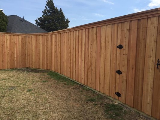 New Fence - This project features a custom 8-foot board-on-board cedar privacy fence, designed to deliver both luxury aesthetics and long-lasting durability. Built with select-grade western red cedar, the fence showcases a staggered overlapping board design that provides 100% privacy with no gaps, even as the wood naturally seasons.

The structure is reinforced with heavy-duty 4x6 pressure-treated posts, set in concrete for maximum stability, and supported by galvanized steel brackets to withstand Florida’s coastal weather conditions. Decorative trim and top cap details were added for a polished, upscale finish.

Benefits of this design include:
	•	🌲 Premium Cedar Wood – Naturally resistant to rot, decay, and insects.
	•	🛡 Complete Privacy – Board-on-board pattern eliminates sight lines.
	•	💪 Durability – Extra height and strong framing ensure long-term performance.
	•	✨ Luxury Look – Rich cedar tones enhance curb appeal and property value.

The result is a timeless, high-end fence that blends security, privacy, and elegance—perfectly reflecting the Barrier Luxe standard of craftsmanship.