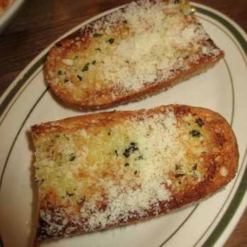 Carmentas Italian Specialties - Garlic Bread with Basil Butter + Parmesan - Italian Near Me - Brooklyn, New York Carmentas Italian Specialties - Garlic Bread with Basil Butter + Parmesan - Italian Near Me - Brooklyn, New York