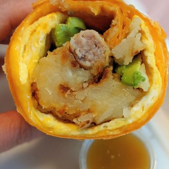 Athenian III - Sausage breakfast burrito, note the orange tortilla and mashed potato looking hashbrowns. With a liquid salsa. - Burgers Near Me - Buena Park, California