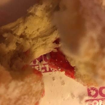Donut Connection - a half eaten donut with a bite taken out of it - Bakeries Near Me - Charleston, West Virginia