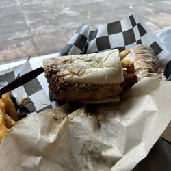 Fat Shack - The fat stickler it's a Philly cheesesteak with french fries and fried pickles
