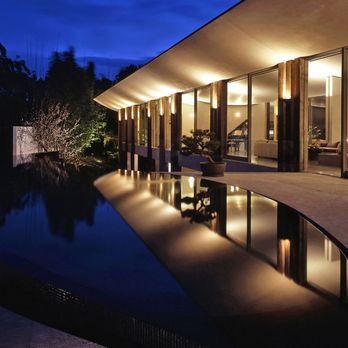 Lawn - a pool and patio at night - Landscape Architects or Designers Near Me - Fallbrook, California