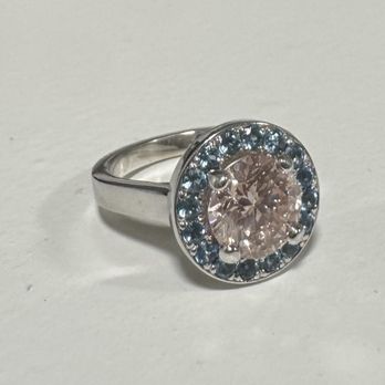 Bacon Jewelers - Custom made ring with a pink diamond surrounded by aquamarine (my sister's birthstone ). - Jewelry Near Me - Boone, Iowa Bacon Jewelers - Custom made ring with a pink diamond surrounded by aquamarine (my sister's birthstone ). - Jewelry Near Me - Boone, Iowa