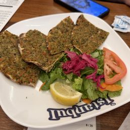 Lahmacun (Lahmajun) - a traditional Anatolian specialty, freshly ground lamb, tomatoes, parsley, green pepper, garlic mix Lahmacun (Lahmajun) - a traditional Anatolian specialty, freshly ground lamb, tomatoes, parsley, green pepper, garlic mix