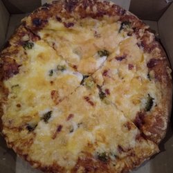 Small pizza. Chicken, pineapple and broccoli. $12.75. All the toppings are under the cheese!
