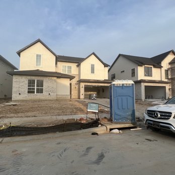 Darling Homes - Port-o-potty in front of the house - General Contractors Near Me - McKinney, Texas