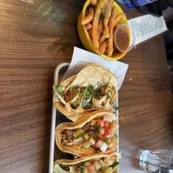 The Grand Cantina - Duck fries, coconut shrimp taco, pollo taco, and carnita taco