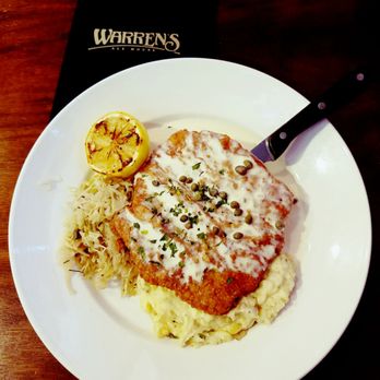 Warren's Ale House - Schweineschnitzel - breaded pork cutlet, buttermilk mashed potatoes, caraway spiked sauerkraut, lemon caper butter sauce - New American Near Me - Wheaton, Illinois