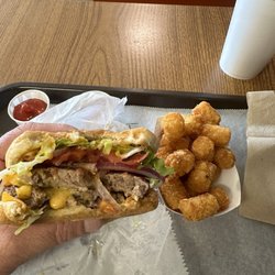 The Hot Dog King - Double Cheeseburger, tater tots, and drink over $14.