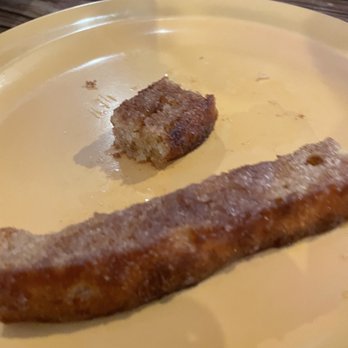 Ken's Pizza - a half eaten donut on a plate - Pizza Near Me - Sapulpa, Oklahoma