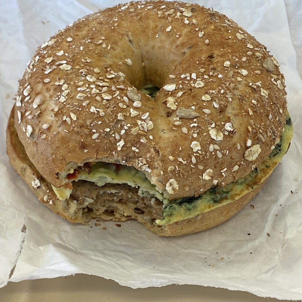 Dunkin' - Egg wire turkey sausage sandwich - minus the first bite. - Donuts Near Me - Gahanna, Ohio