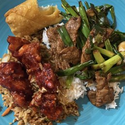 General tsos chicken with veggie fried rice, steak and scallion and an egg roll General tsos chicken with veggie fried rice, steak and scallion and an egg roll