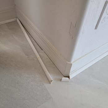 Curtis Allen Designs - a corner of a kitchen with a white refrigerator - Interior Design Near Me - Fort Myers, Florida Curtis Allen Designs - a corner of a kitchen with a white refrigerator - Interior Design Near Me - Fort Myers, Florida