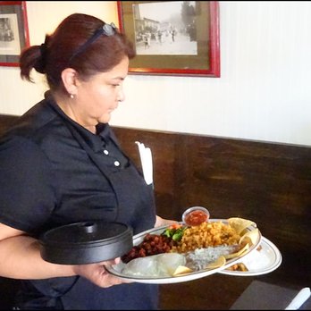 Cambria Cafe - Meet Manuela, our friendly server, as she brings both of our breakfast orders to us, in one trip, with a great balancing act. - American Near Me - Cambria, California