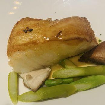 The Capital Grille - Pan-Seared Sea Bass with Shiitake Mushrooms, Asparagus and Miso Butter - Steakhouses Near Me - Miami, Florida