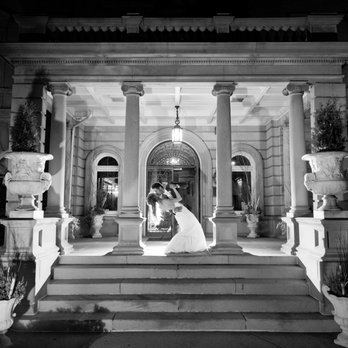 Semple Mansion - Bride and Groom on the front steps of Semple Mansion - Venues & Event Spaces Near Me - Minneapolis, Minnesota